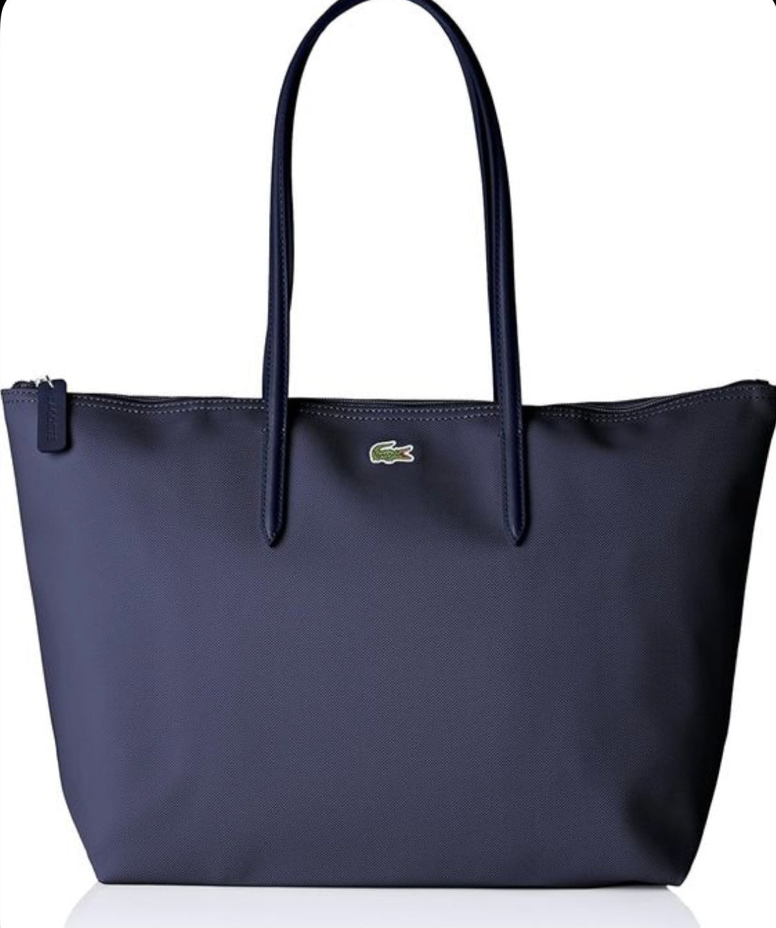 Navy blue tote bag with a brand logo on a white background